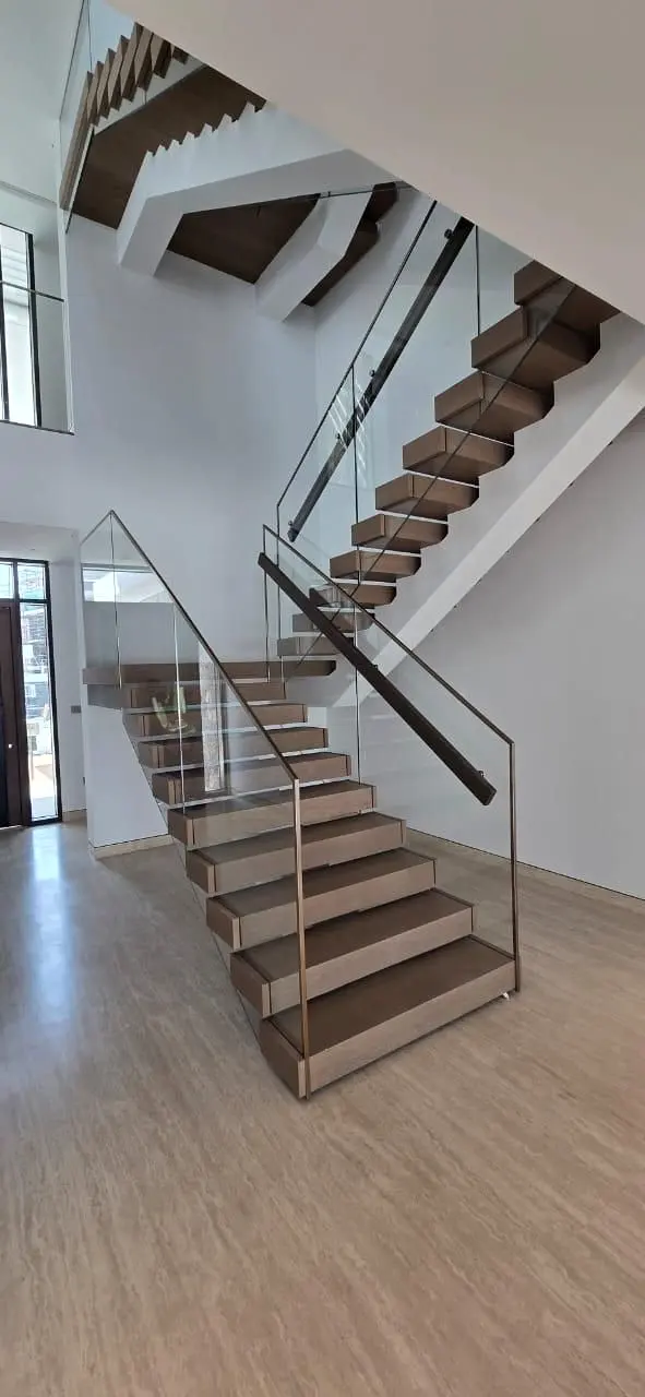Floating timber stair and glass balustrade from the lower flight