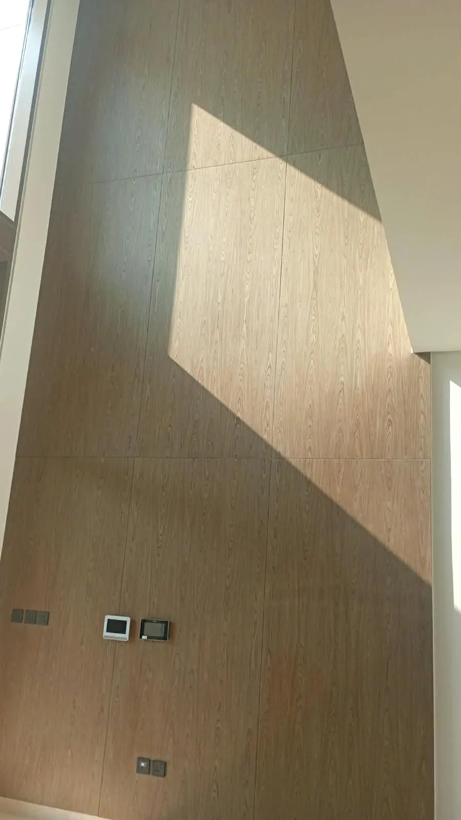 Full-height timber wall cladding in the stair void
