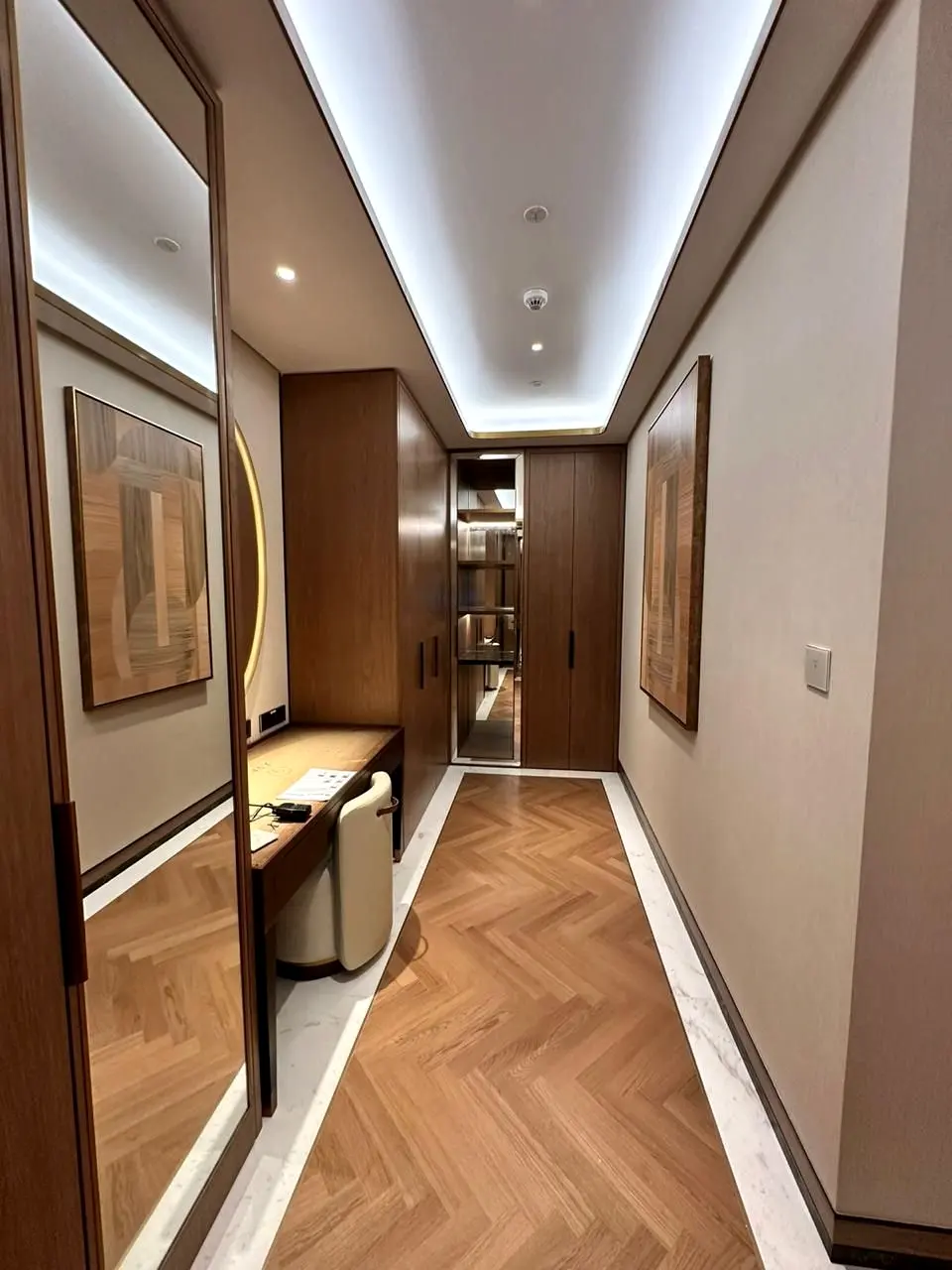 Suite corridor with herringbone timber floor and timber wall panelling
