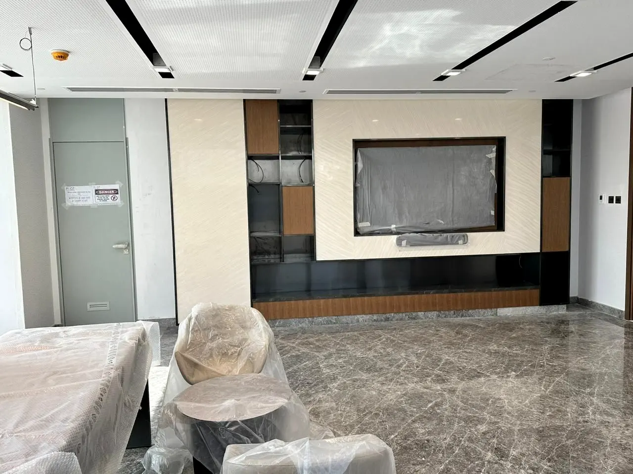 Media wall with display joinery and stone floor