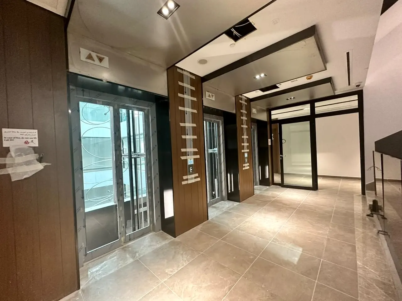 Lift lobby corridor with timber cladding and ceiling detail