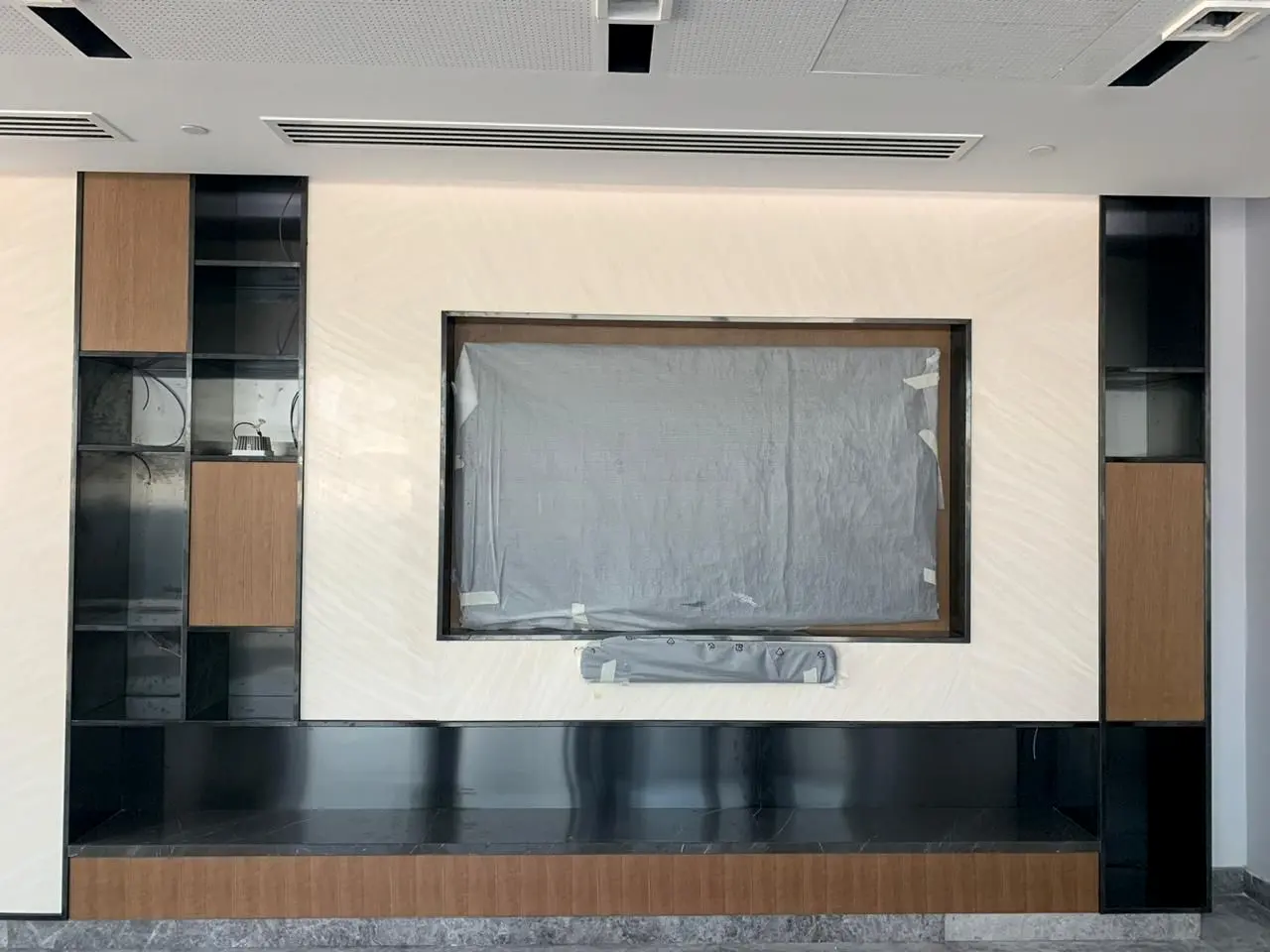 Media wall with timber and dark joinery panels