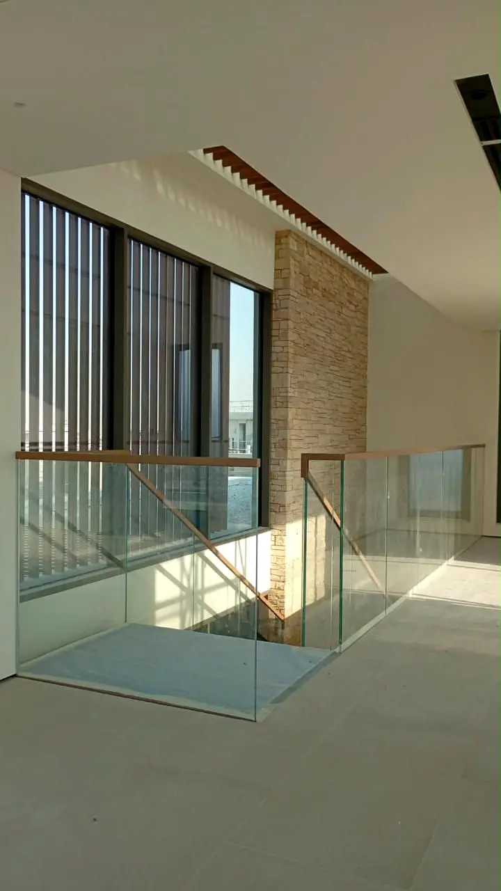 Glass balustrade around the stair void on the upper floor